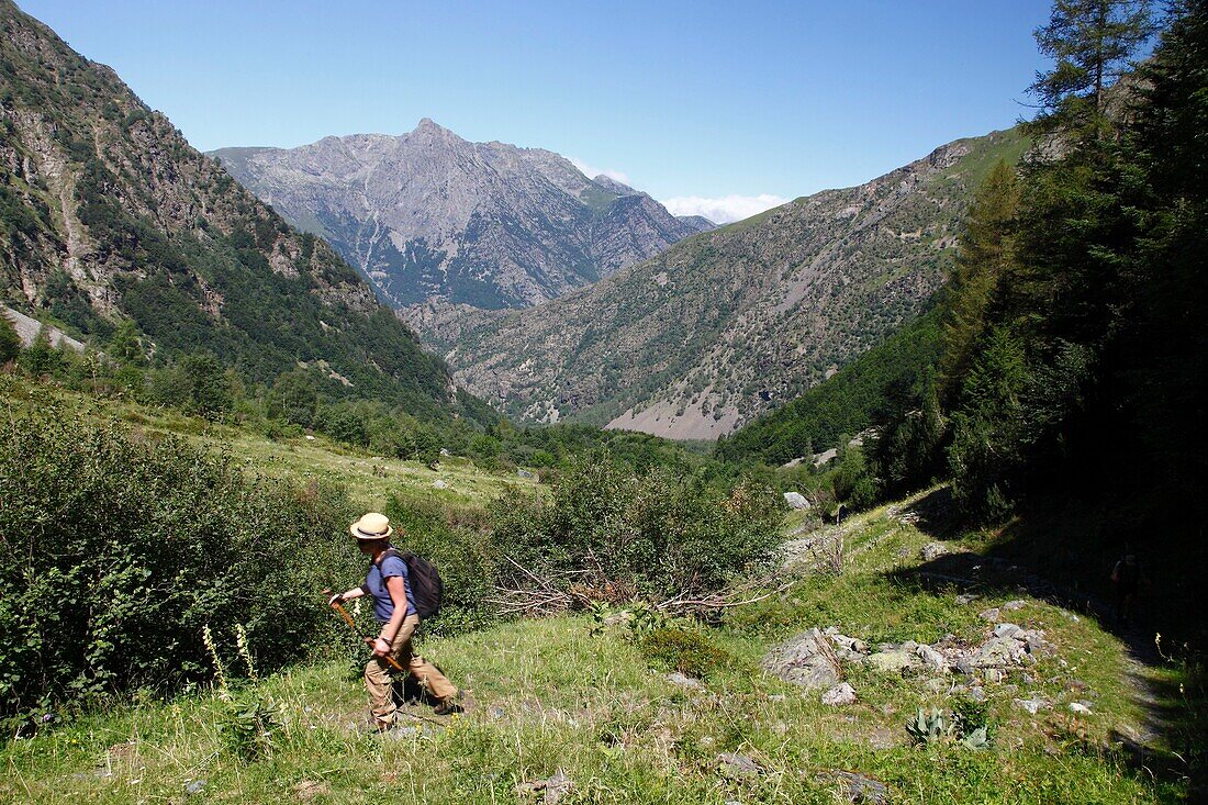 France, Isere, Lavaldens, Female hiker on the path toward Rif bruyant lake