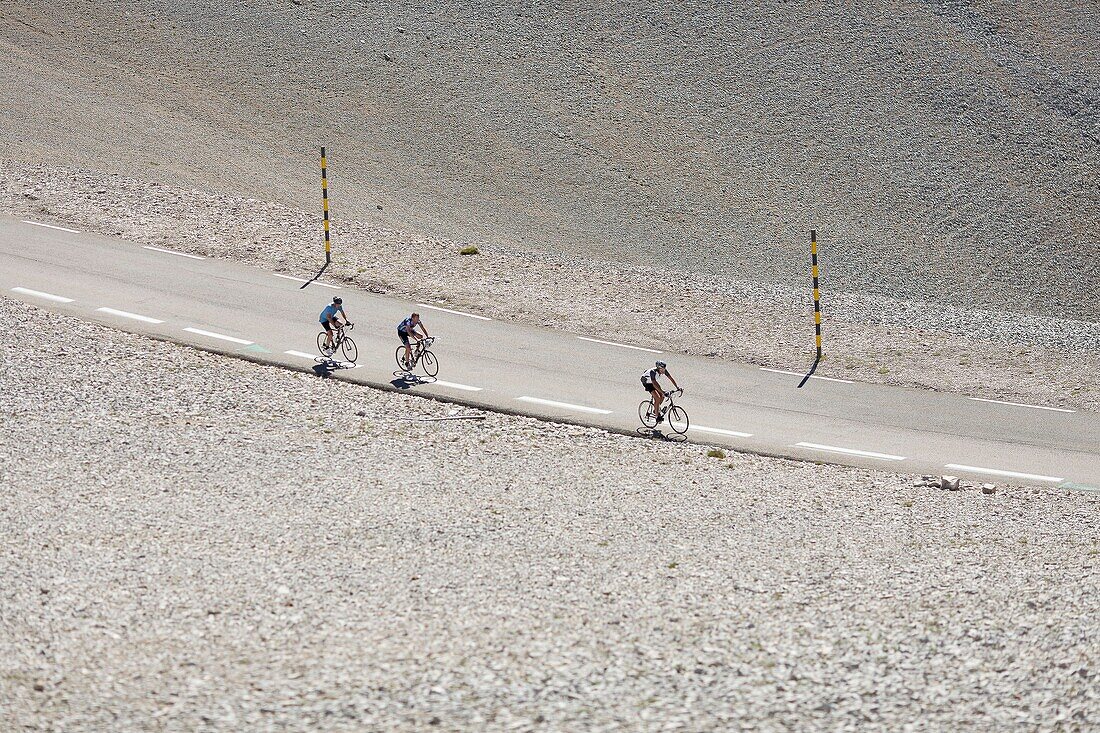France, Vaucluse, Bedoin, three cyclists arriving at the Mont Ventoux (1912 m) summit