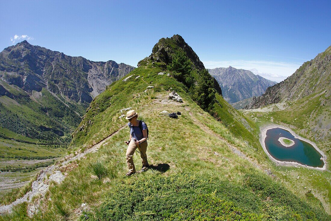 France, Isere, Lavaldens, Female hiker above the Rif bruyant lake