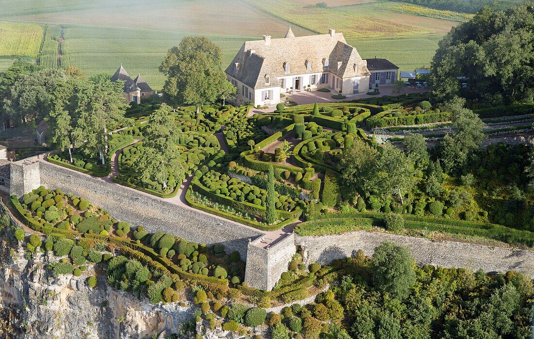 France, Dordogne, Perigord Noir, Dordogne Valley, Vezac, Les Jardins du chateau de Marqueyssac, park and castle (aerial view)