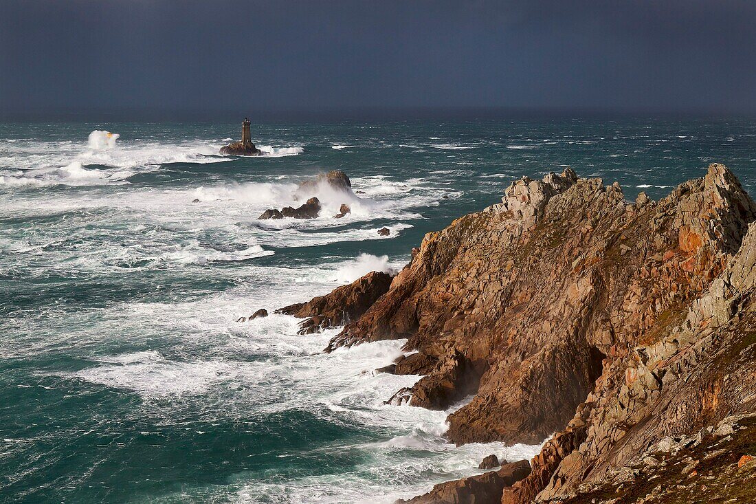 France, Finistère, Mer d'Iroise, Cap Sizun, Plogoff, the Pointe du Raz in bad weather in winter, La Vieille lighthouse in the Raz de Sein, Classified Great National Site