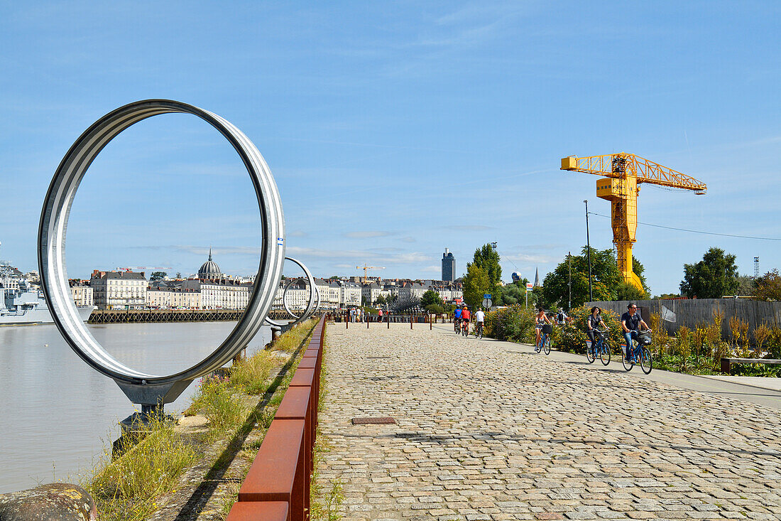 France, Loire Atlantique, Nantes, Ile de Nantes, quai des Antilles, Buren's rings on Loire River quays and the cupola of Notre Dame du Bon Port and the yelow Titan crane