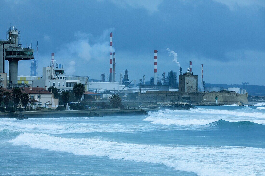 France, Bouches du Rhone, Port de Bouc, Harbor of the western basins of the Grand Port Maritime of Marseille, Fort de Bouc lighthouse and petrochemical platform of Lavéra in the background