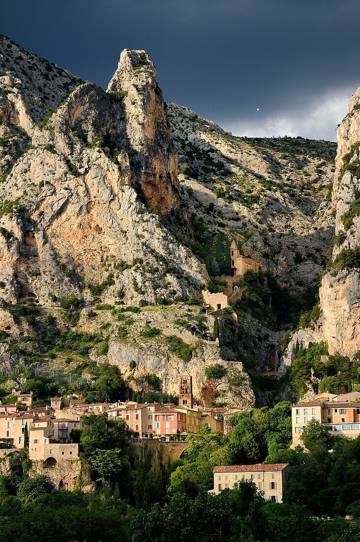 France, Alpes de Haute Provence, Parc Naturel Regional du Verdon, village of Moustiers Sainte Marie, labelled Les Plus Beaux Villages de France (The Most Beautiful Villages of France) and the Star of Moustier hanging on a chain several tens of meters above the ground