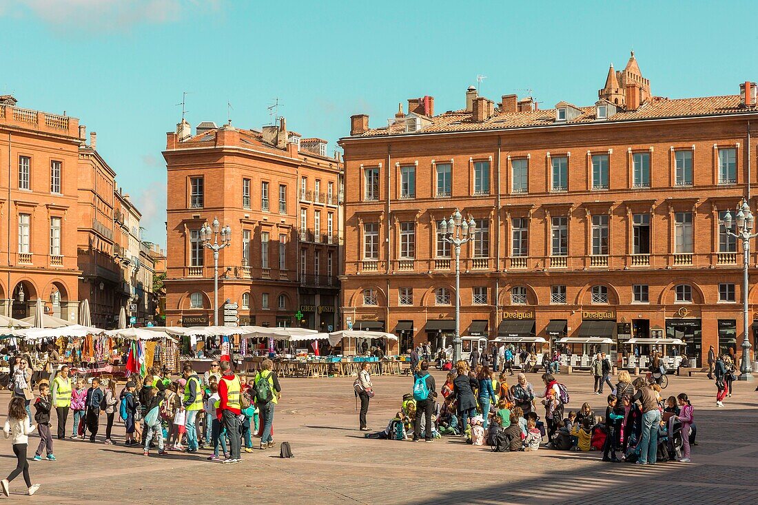 France, Haute-Garonne, Toulouse, listed at Great Tourist Sites in Midi-Pyrenees, Capitole square, group of children visiting the Place du Capitole
