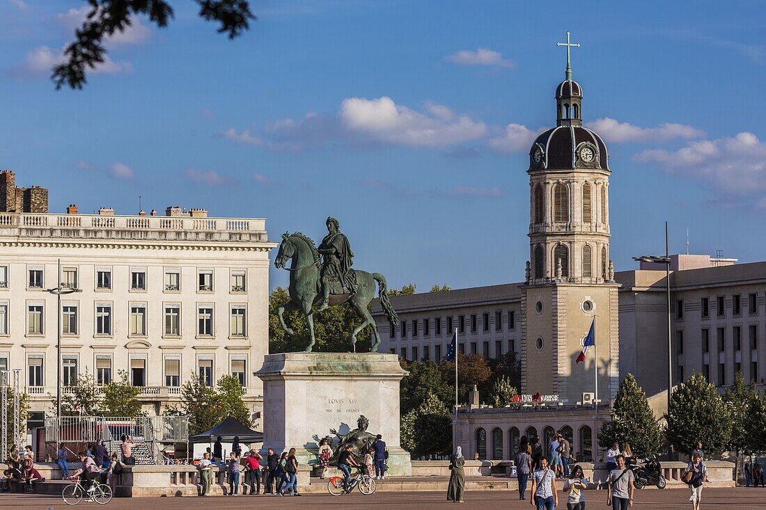 France, Rhone, Lyon, place Bellecour or place Louis-le-Grand (62 000 m2), equestrian statue of Louis XIV and bell tower of the Charity places Antonine Poncet, bell tower-tour of the former hospital of the Charity