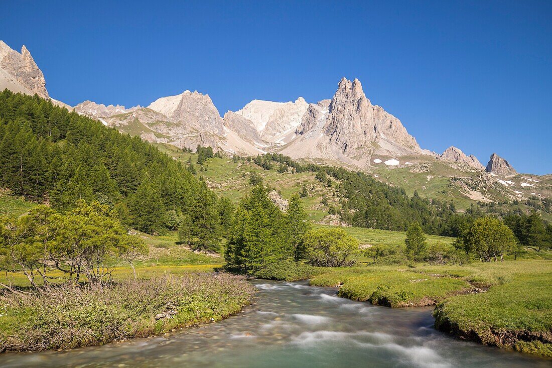 France, Hautes Alpes, Nevache, La Claree valley, la Claree river with in the background the massif of Cerces (3093m) and the peaks of the Main de Crepin (2942m)
