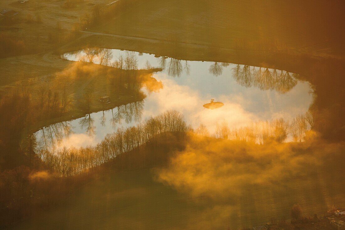 France, Pyrenees, Ariege, Mirepoix, aerial view of a pond in the morning mist