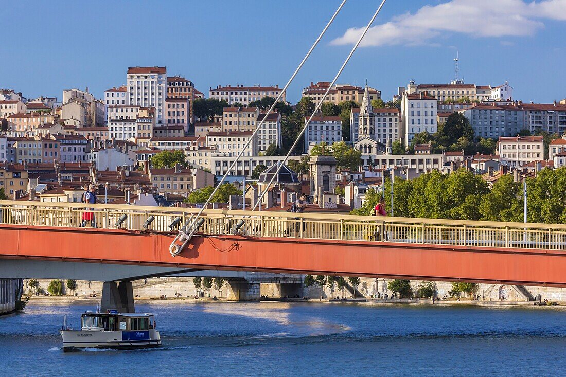 France, Rhone, Lyon, historical site listed as World Heritage by UNESCO, Vieux Lyon (Old Town), footbridge of the Palais de Justice on the Saone river connecting the Cordeliers district to the Vieux Lyon district with a view of the Croix-Rousse district and Bon-Pasteur church, the river shuttle Vaporetto