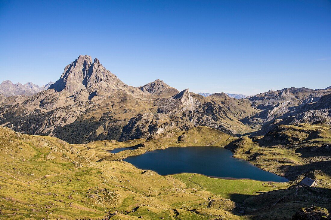France, Pyrenees Atlantiques, Bearn, hiking in the Pyrenees, GR10 footpath, view on the lakes of Gentau and Miey and the Pic du Midi d'Ossau