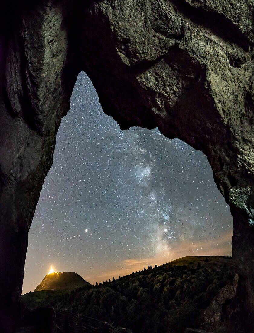 France, Puy de Dome, the Regional Natural Park of the Volcanoes of Auvergne, Chaine des Puys, listed as World Heritage by UNESCO, Orcines, night view of the Puy de Dôme from caverns of volcano Le Cliersou