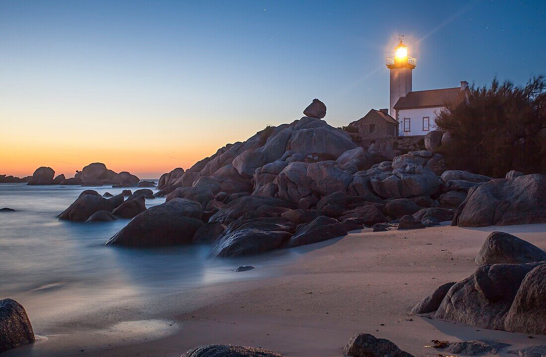 France, Finistere, Pays des Abers, Brignogan Plages, the Pontusval Lighthouse on the Pointe de Beg Pol at sunset