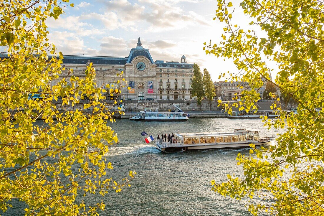 France, Paris, the banks of the Seine listed as World Heritage by UNESCO, a fly boat in front of the Musee d'Orsay