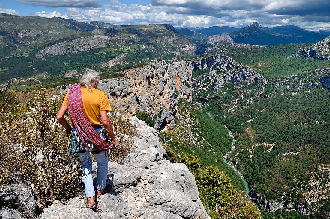 France, Alpes de Haute Provence, Parc Naturel Regional du Verdon, Grand Canyon of Verdon river, La Palud Sur Verdon, point of view of the Dent d'Aire, Bernard Gorgeon one of the pioneers of climbing in the massif and the Escales cliff in the background