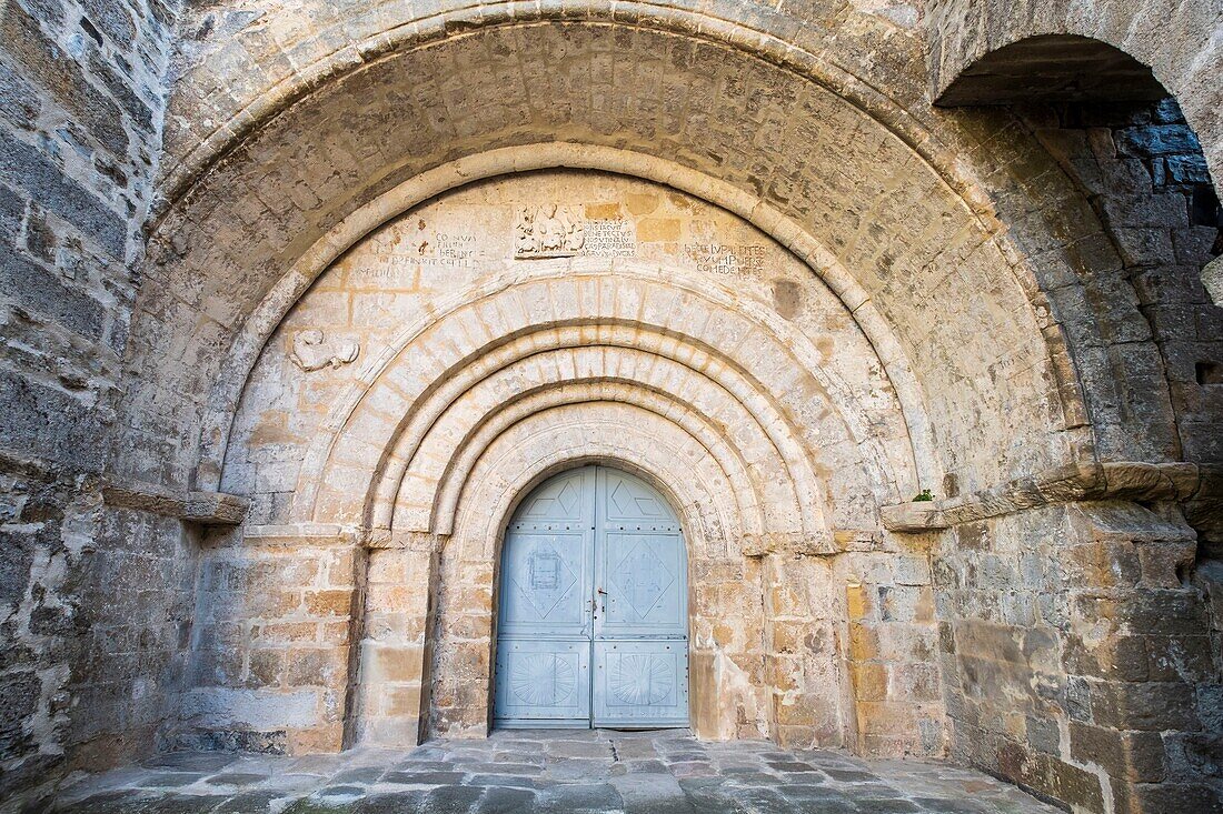 France, Ardeche, Monts d'Ardeche Regional Nature Park, Vesseaux, gate of the 12th century Romanesque church Saint Pierre aux Liens