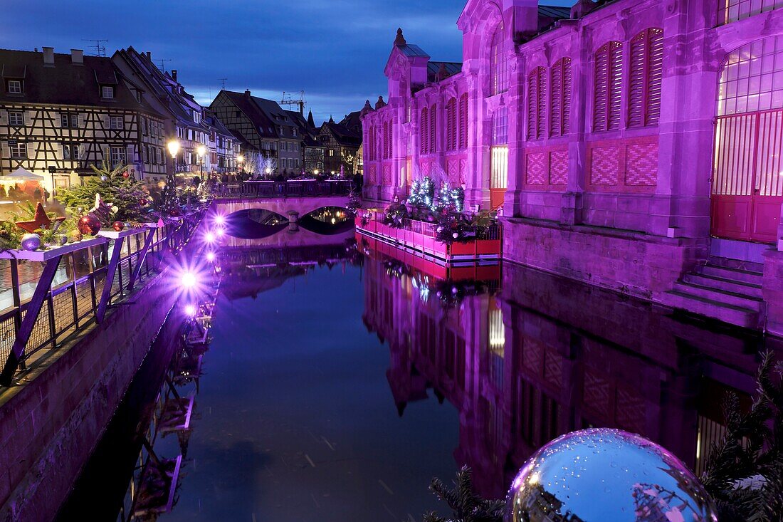 France, Haut Rhin, Colmar, Petite Venise, Quai de la Poissonnerie, bidge over La Lauch river, timbered houses, covered market hall dated 1865, illuminations during the Christmas market