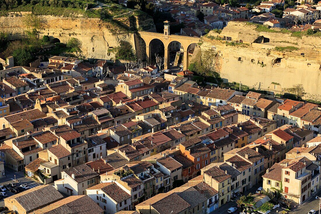 France, Bouches du Rhone, Saint Chamas, aqueduct, the "Bridge of the Clock" linking the hills of Moulières and Baou (aerial view)