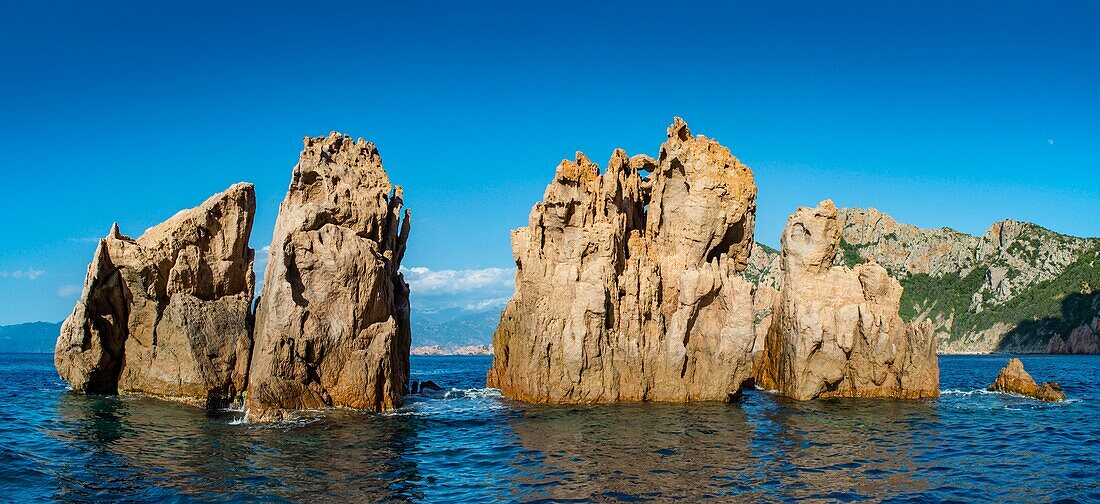 France, Corse du Sud, Porto, Gulf of Porto listed as World Heritage by UNESCO, panoramic view of islands of sharp rocks Ocher color off Capo Rosso,