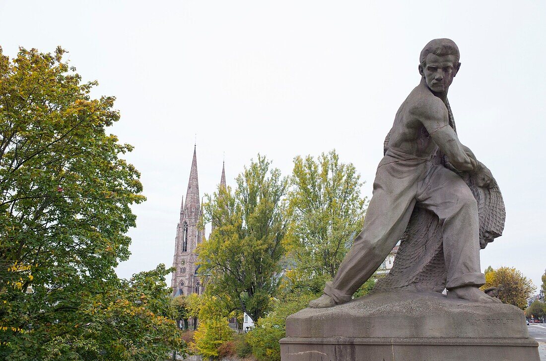 France, Bas Rhin, Strasbourg, old city and German district listed on UNESCO World Heritage list, sculpture on Avenue d'Alsace bridge and Saint Paul church
