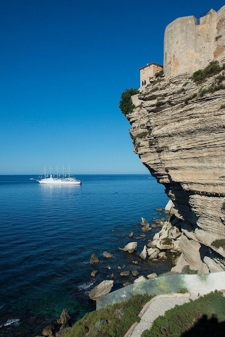 France, Corse du Sud, Bonifacio, the upper town located in the citadel is built on limestone cliffs overlooking the sea where is anchored the sailboat 4 mats of the Mediterranean club