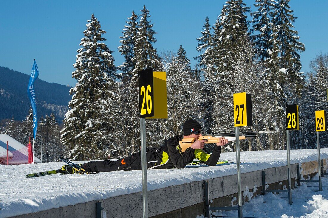 France, Haute Savoie, Massif of the Mont Blanc, the Contamines Montjoie, biathlon athlete training on the firing point of Nordic space, shot in lying position