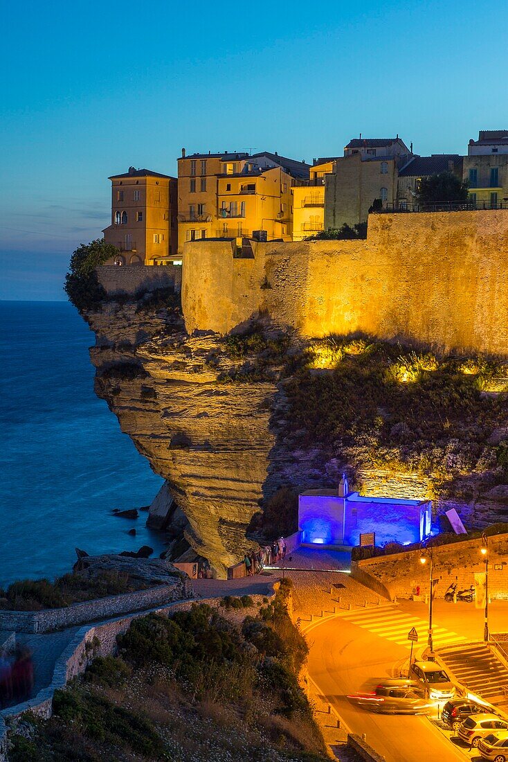 France, Corse du Sud, Bonifacio, light show on the citadel and the bastion of the Etendard seen from the footpath of the cliffs at dusk