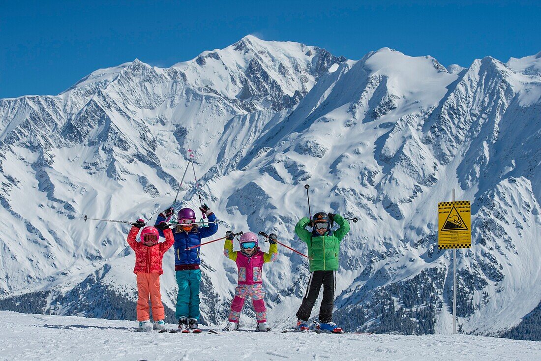 France, Haute Savoie, Massif of the Mont Blanc, the Contamines Montjoie, groups of children on the ski area in quoted by a descriptive panel for avalanche