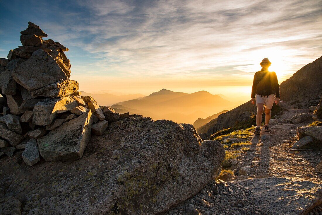 France, Haute Corse, Corte, Restonica Valley, hiking in the Regional Nature Park, on the GR 20, passing the southern ridge of Punta Muzella, view towards the Fiume Valley at sunset