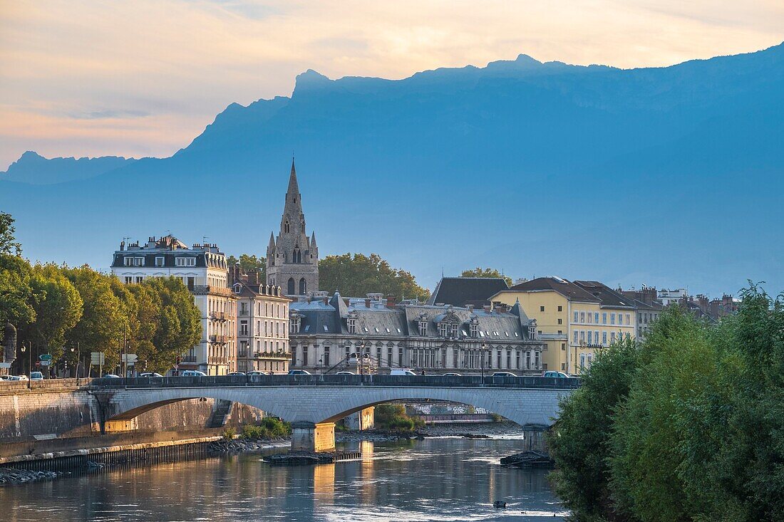France, Isere, Grenoble, the banks of Isere river, 13th century Saint Andre church and Vercors massif in the background