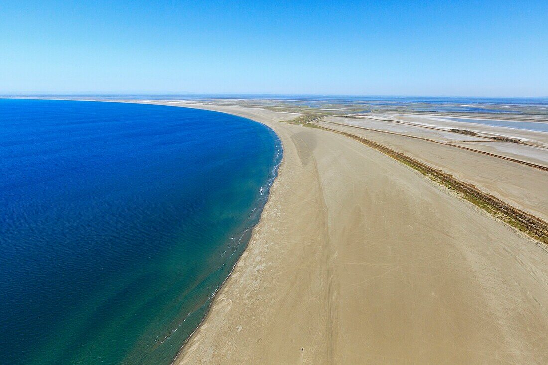 France, Bouches du Rhone, Camargue Regional Nature Park, Saintes Maries de la Mer, Beauduc beach, Galabert pond in the background (aerial view)