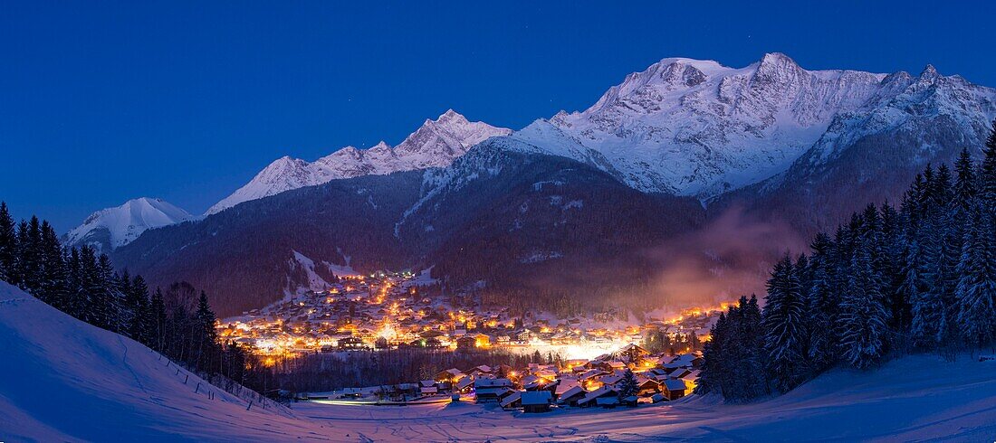 France, Haute Savoie, Massif of the Mont Blanc, the Contamines Montjoie, the panorama on the village in the twilight and summits of the massif of the Mont Blanc from left to right, mount Vorassay Tricot pass, Tricot needle, in the center Bionnassay needle, Miage dome(3673m and Berangere needle