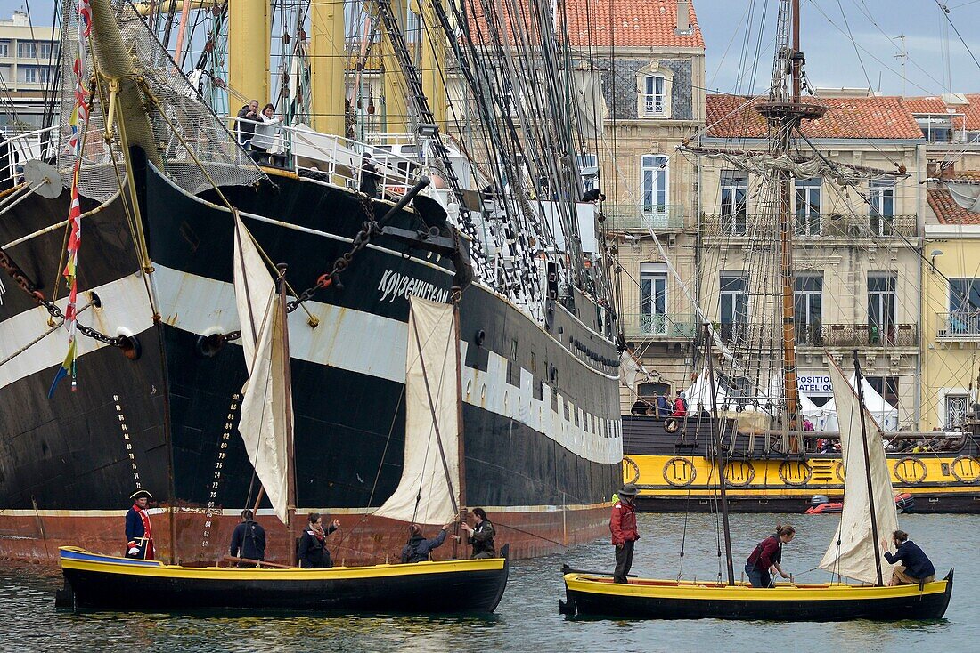 France, Herault, Sete, Escale a Sete festival, party of the maritime traditions, Passage of traditioinnelles sails in front of the Russian sailboat Kruzensthern
