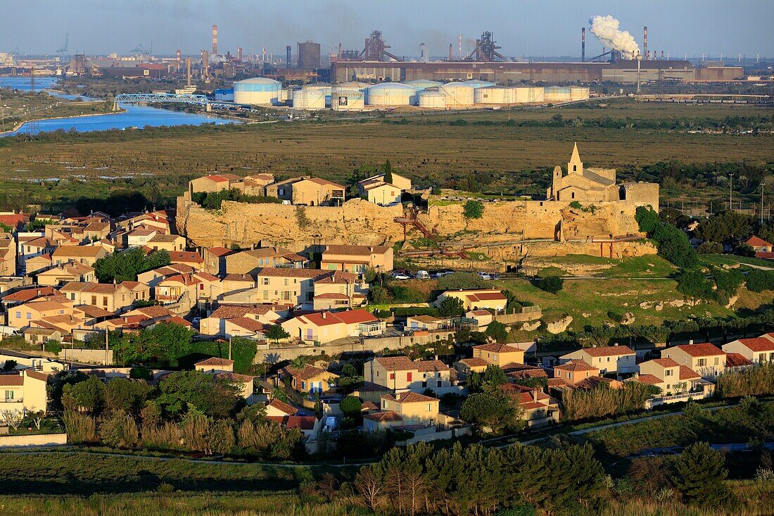 France, Bouches du Rhone, Fos sur Mer, Saint Sauveur Church, Industrial Zone in the background (aerial view)