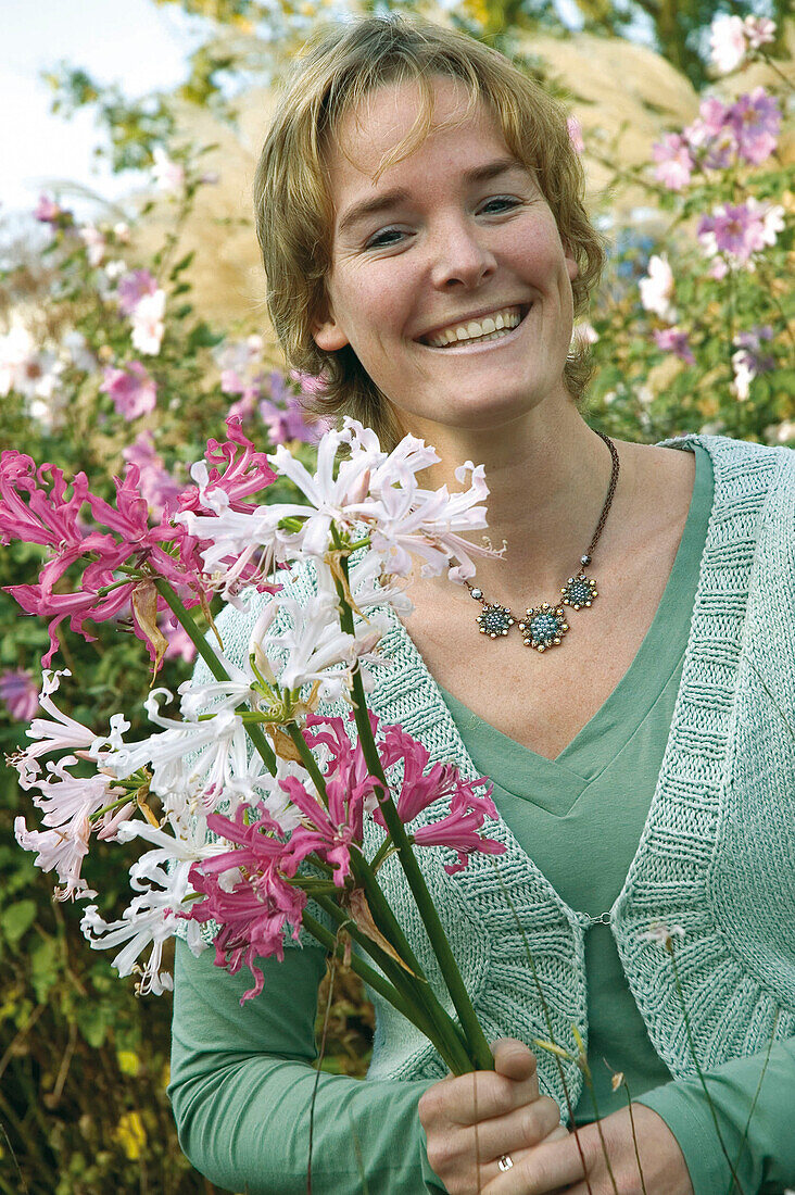 Woman holding nerine