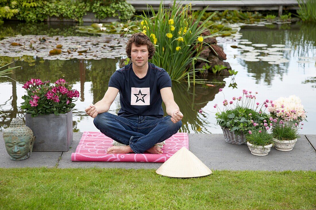Man meditating in garden