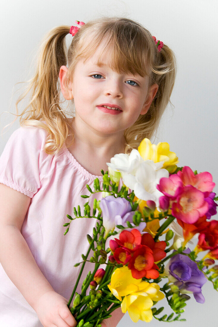 Girl holding Freesia