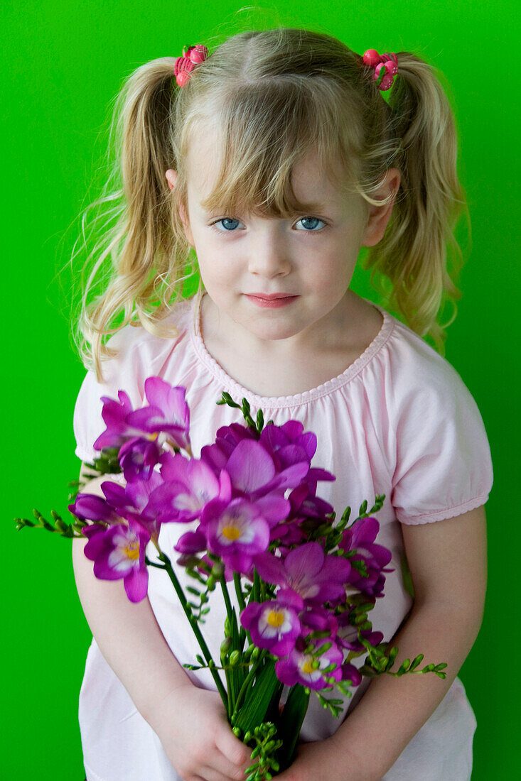 Girl holding freesia