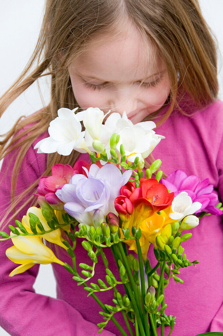 Girl holding freesia