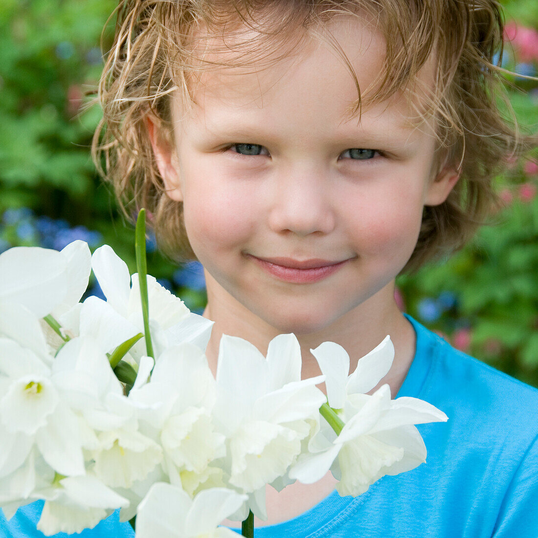 Boy holding daffodil