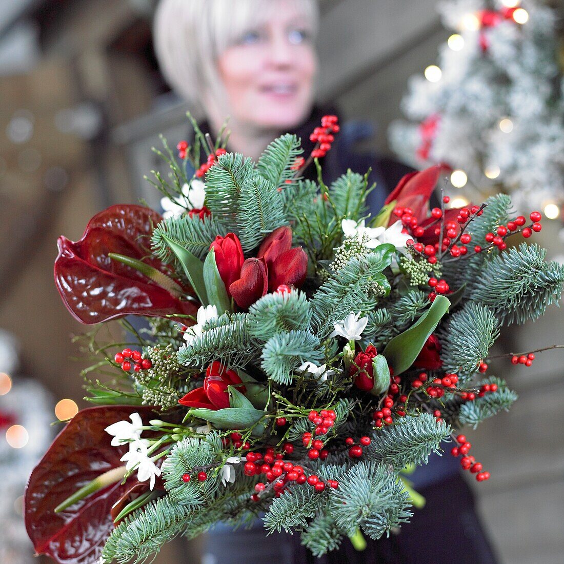 Woman holding christmas bouquet