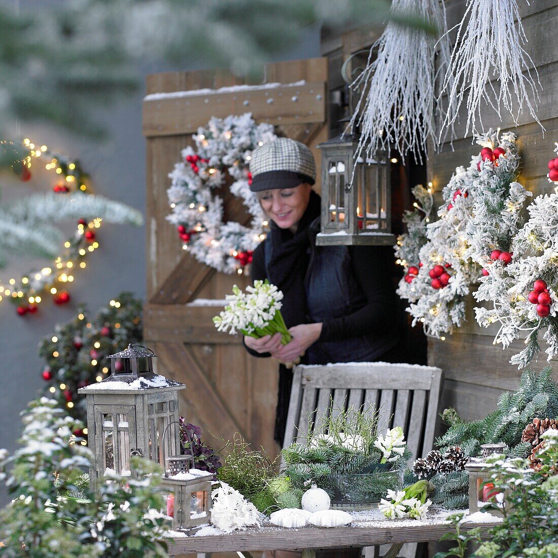 Woman making christmas arrangement