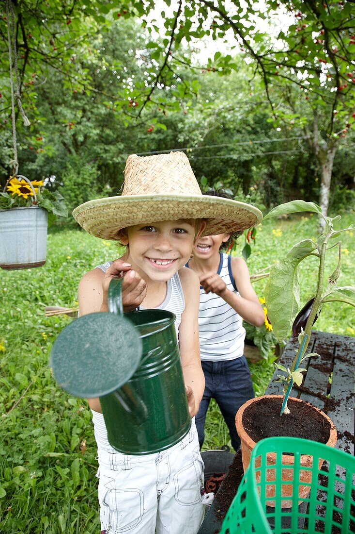 Boy with watering can