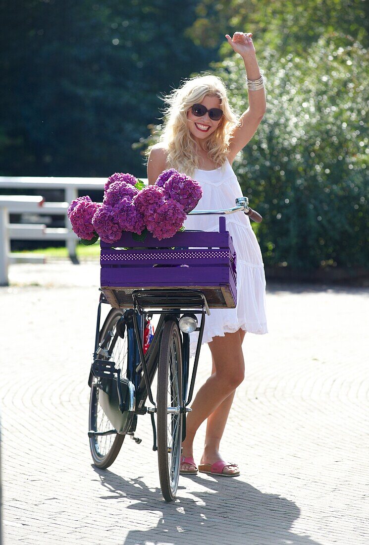 Woman with bike in park