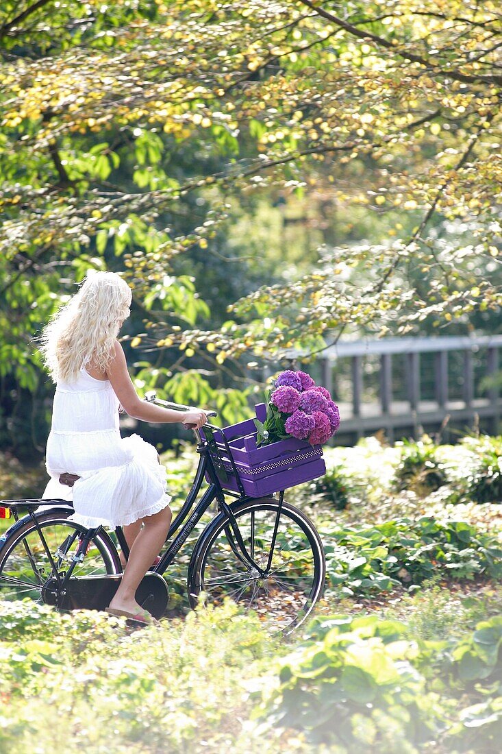 Woman riding bike in park