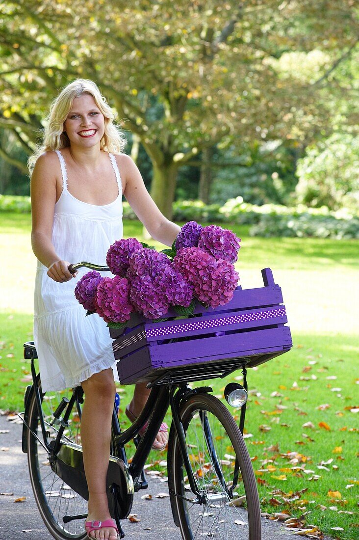 Woman riding bike in park