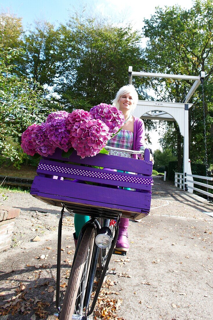 Woman riding bike in park