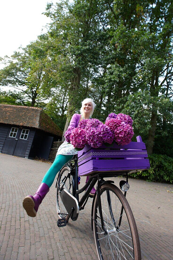 Woman riding bike in park