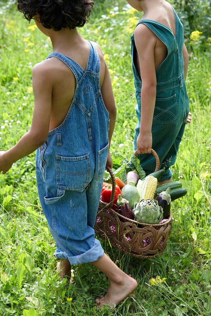 Children carrying vegetables