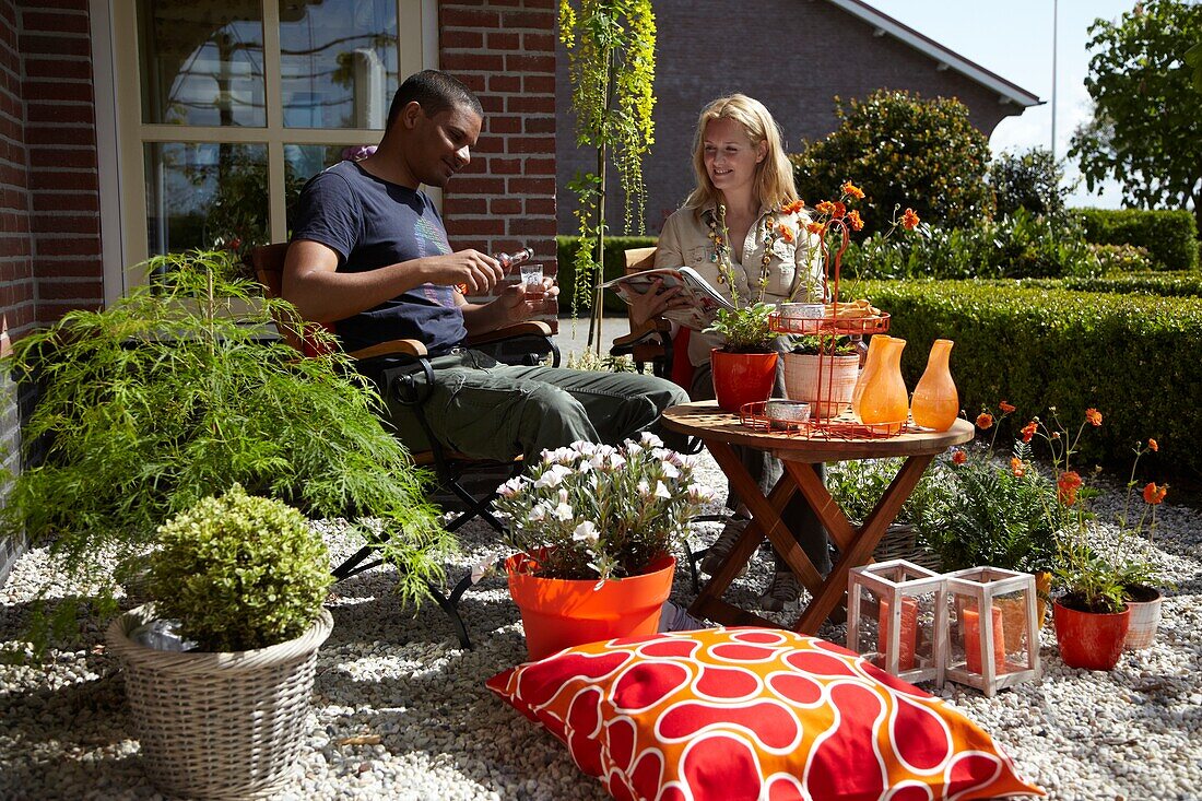 Couple relaxing on terrace