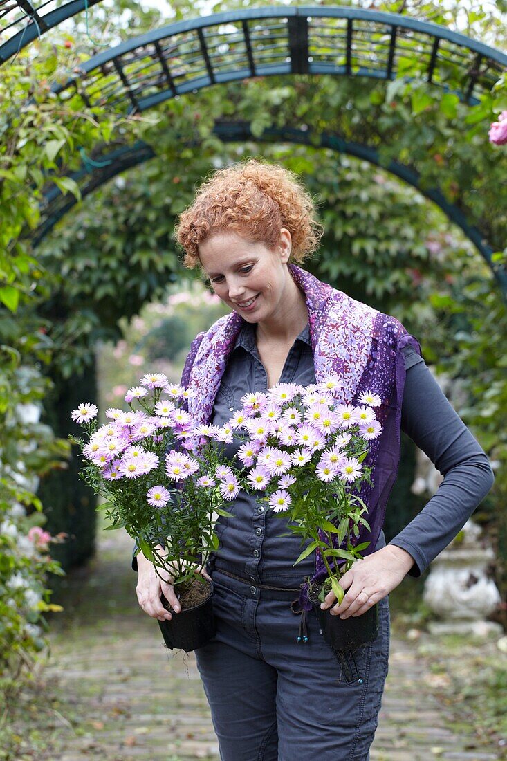 Woman holding aster